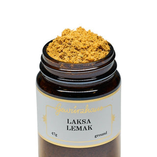 Jar of Laksa Lemak spice mix with a white label on a white background