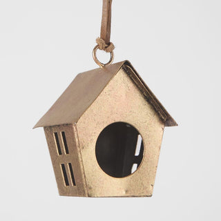 Bronze-colored birdhouse with a round window on a light gray background