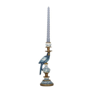 Decorative candle holder with a bird design on a white background