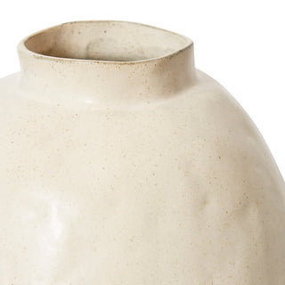 Close-up of a beige ceramic vase on a white background