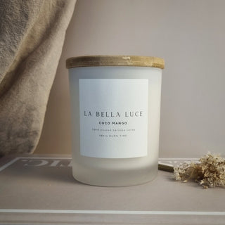 Candle with 'La Bella Luce' label on a neutral background