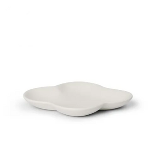 White ceramic dish with cloud design on a white background