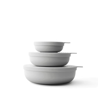 Set of three gray bowls of different sizes on a white background