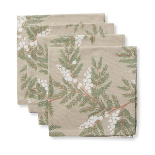 Set of three folded napkins with floral pattern on a beige background