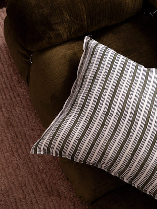 Striped pillow on a brown couch