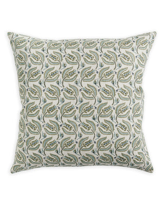 Decorative pillow with leaf pattern on a white background