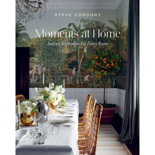 Book cover of 'Moments at Home' by Steve Cordony featuring a dining room with floral arrangements and chairs.