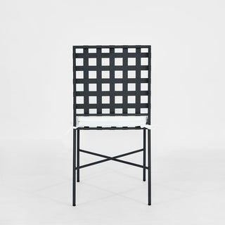 Black metal chair with a grid pattern on a white background