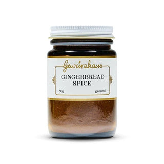 Jar of gingerbread spice with a white label on a white background