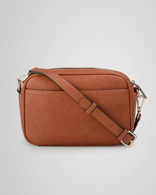 Brown leather crossbody bag on a light gray background
