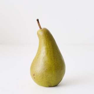 Green pear on a white background