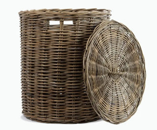 Wicker laundry basket with a lid on a white background