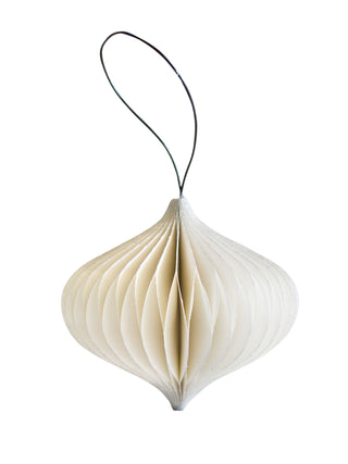 White hanging decorative item with a black string on a white background