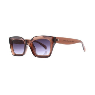 Sunglasses with brown frame and gradient lenses on a white background