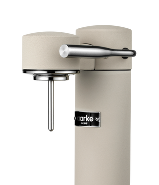 Beige kitchen faucet with silver handle on a white background