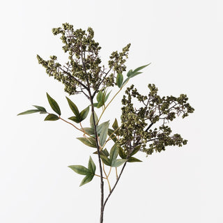 Artificial plant branch with green leaves and buds on a white background