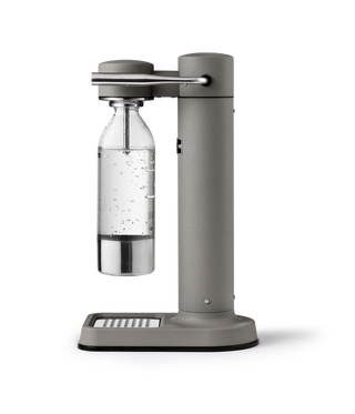 Gray carbonation device with a bottle on a white background