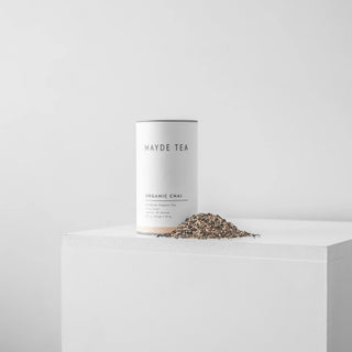 Mayde Tea Organic Chai packaging with loose tea leaves on a white background