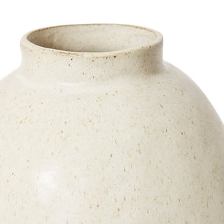 Close-up of a beige ceramic vase on a white background