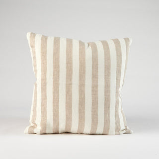 Striped pillow with beige and white stripes on a light gray background