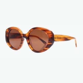 Tortoiseshell sunglasses with brown lenses on a white background