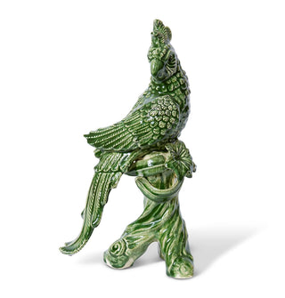 Green ceramic parrot sculpture on a white background
