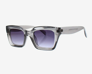 Sunglasses with transparent frame and gradient purple lenses on a white background