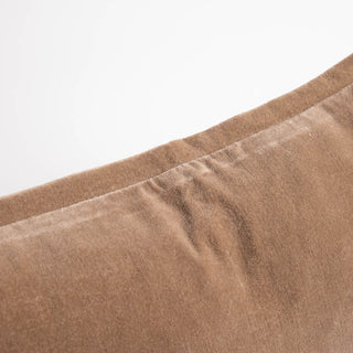 Close-up of brown fabric with a white background