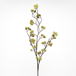 Artificial plant branch with green berries on a white background
