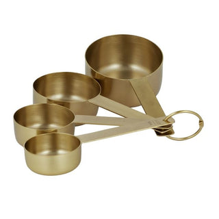 Set of gold measuring cups with a handle on a white background