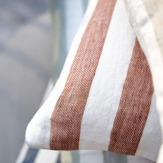 Close-up of a striped fabric with brown and white colors.
