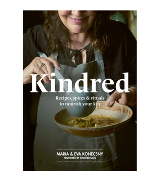 Book cover of 'Kindred' with a person serving food, featuring Maria & Eva Konecsny.