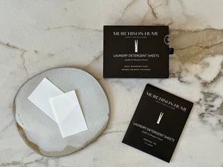 Murchison-Hume laundry detergent sheets on a marble surface