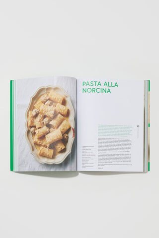 Open cookbook showing a recipe for 'Pasta alla Norcina' with an image of pasta on a white background.