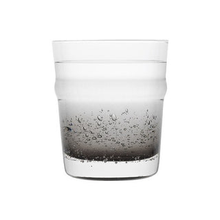 Clear glass with water droplets on a white background