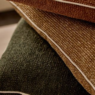 Close-up of brown and green textured fabric with a white line.