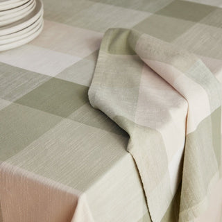 Checkered tablecloth with a soft color palette on a table.
