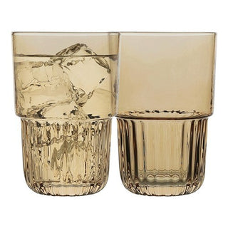 Two amber-colored glass tumblers with textured design on a white background