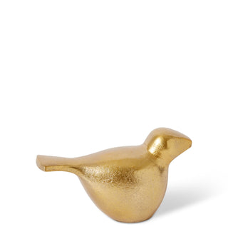 Gold bird-shaped decorative object on a white background