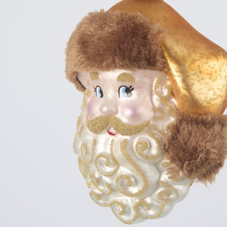Decorative ornament resembling a bearded figure with a brown hat and gold accents on a light gray background