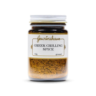 Jar of Greek grilling spice with a white label on a white background
