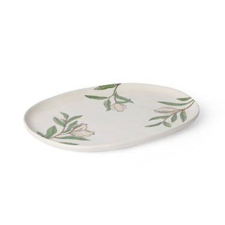 Decorative plate with floral and leaf patterns on a white background