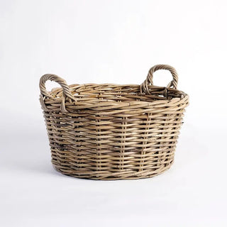 Wicker basket with handles on a white background