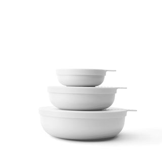 Set of three white bowls stacked on a white background