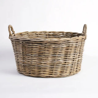 Wicker basket with handles on a white background