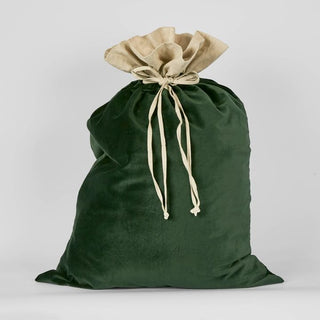 Green drawstring bag with beige ribbon on a white background