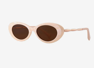 Heart-shaped sunglasses with beige frame and dark lenses on a white background