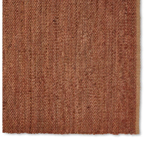 Brown textured rug on a white background