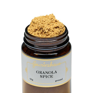 Jar of granola spice with a visible brand label on a white background