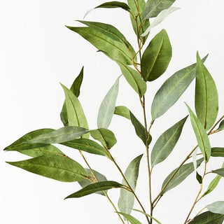 Artificial green leaves on a white background
